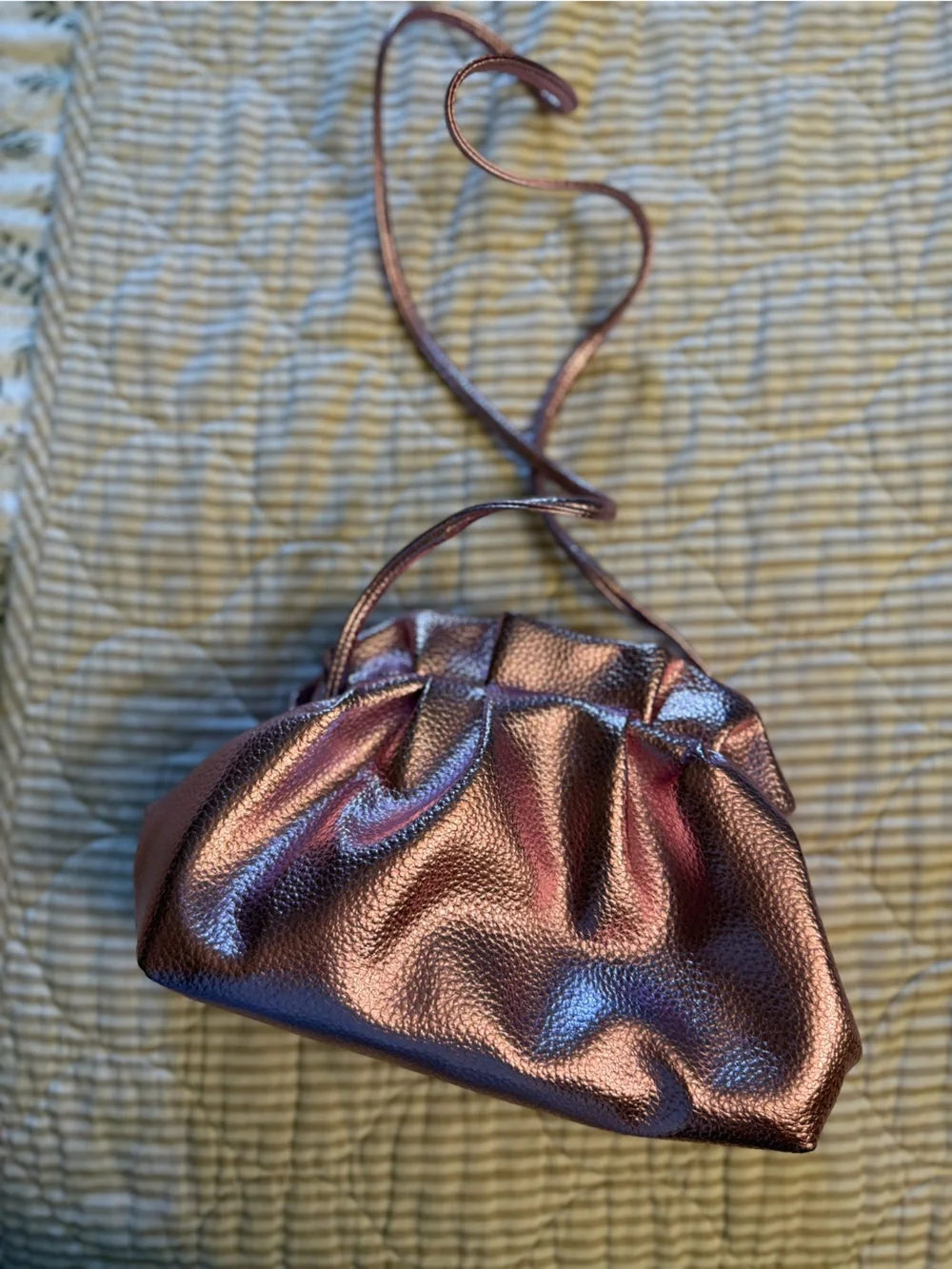 Metallic pink ruffle clutch